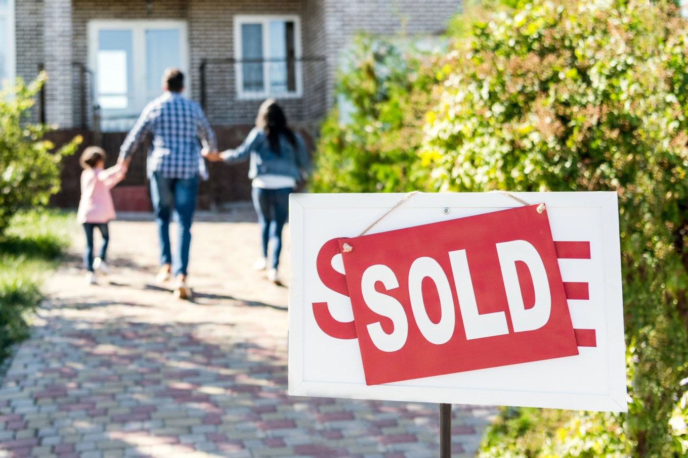 Sold sign in front of a home