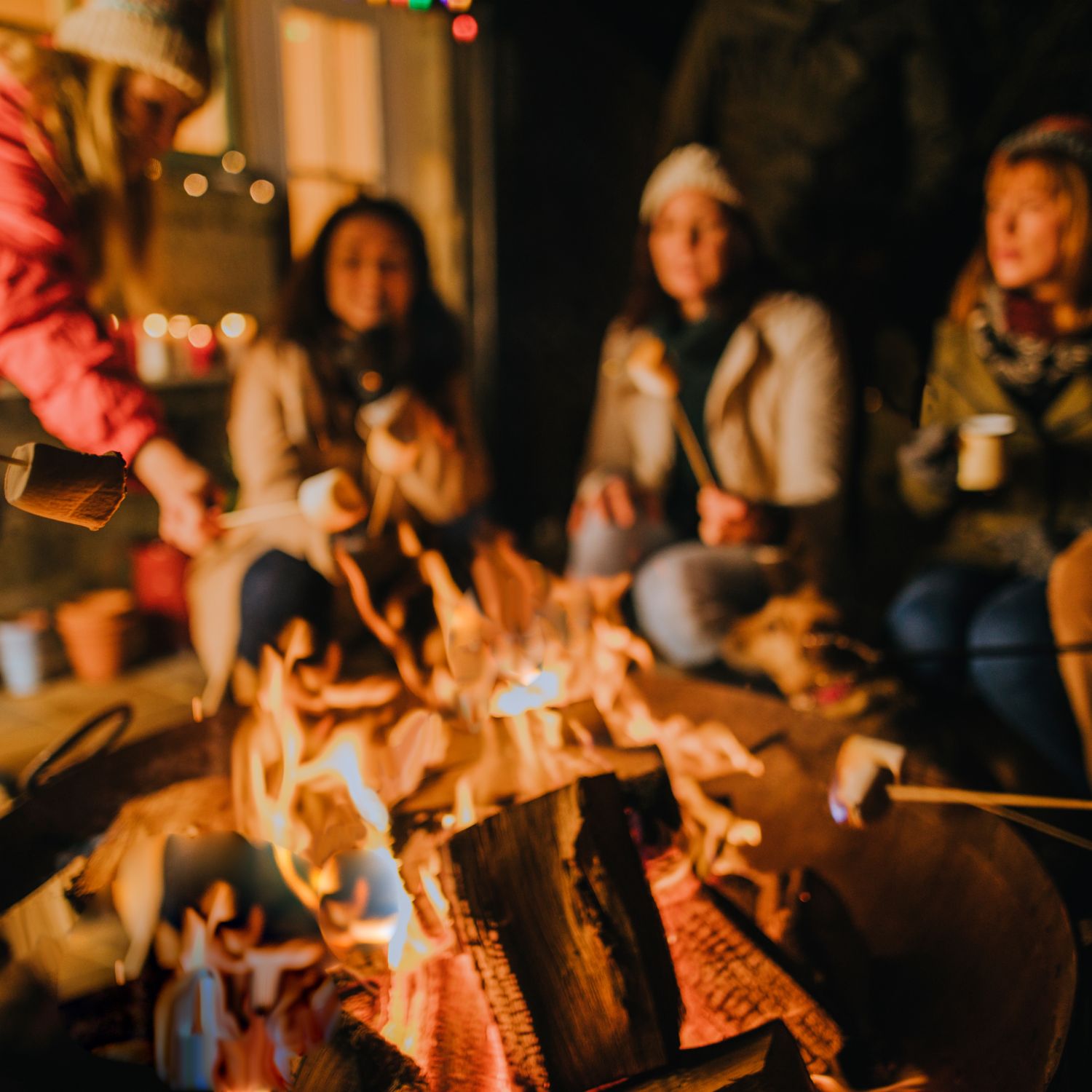 Friends having fun around a DIY fire pit