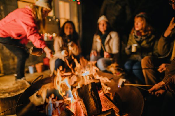 Friends having fun around a DIY fire pit