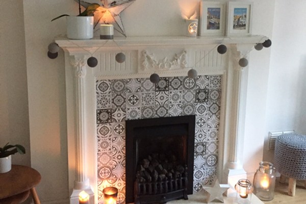A fireplace with tile stickers