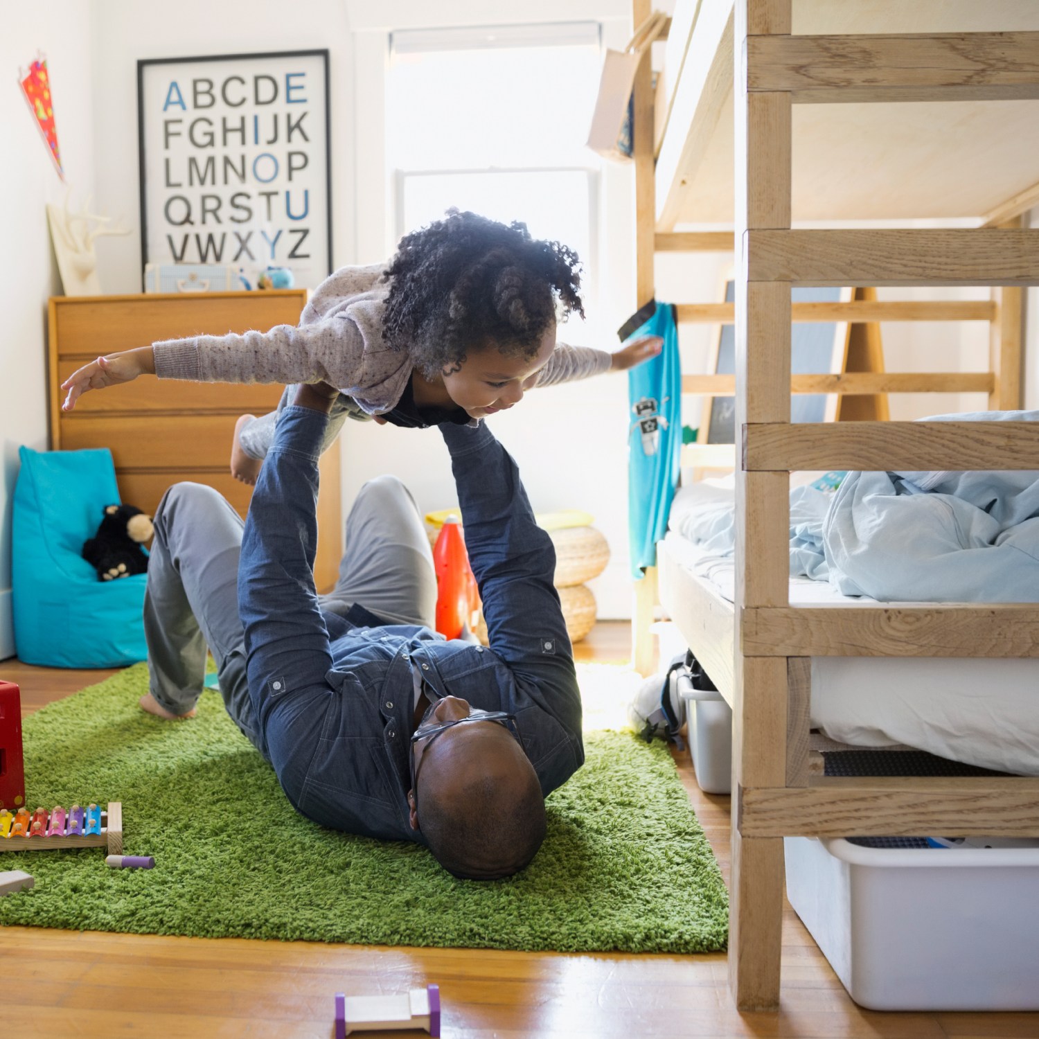 Kid and parent playing instead of cleaning