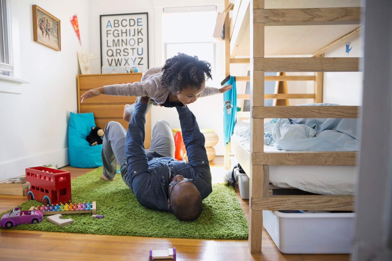 Kid and parent playing instead of cleaning