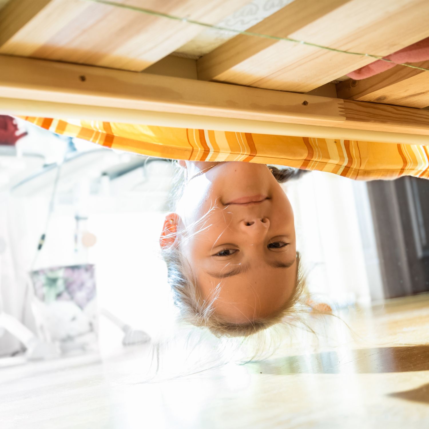 Looking underneath the bed for dust bunnies