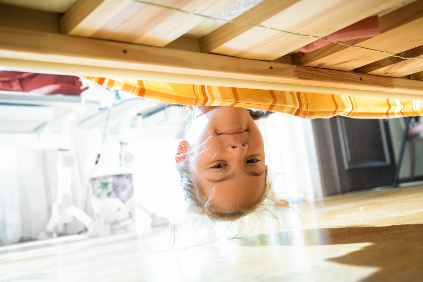 Looking underneath the bed for dust bunnies