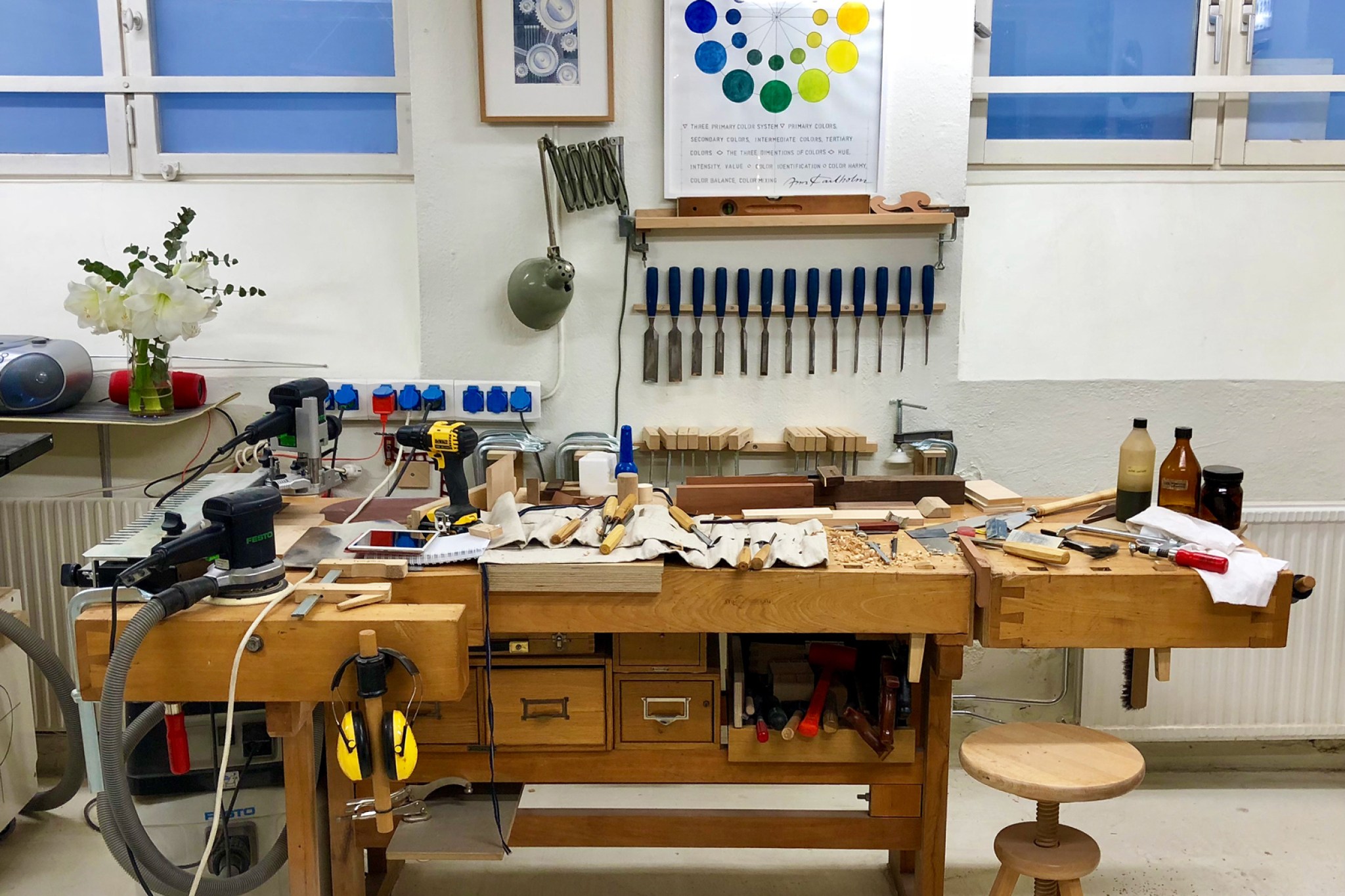 A messy wood work bench in a basement