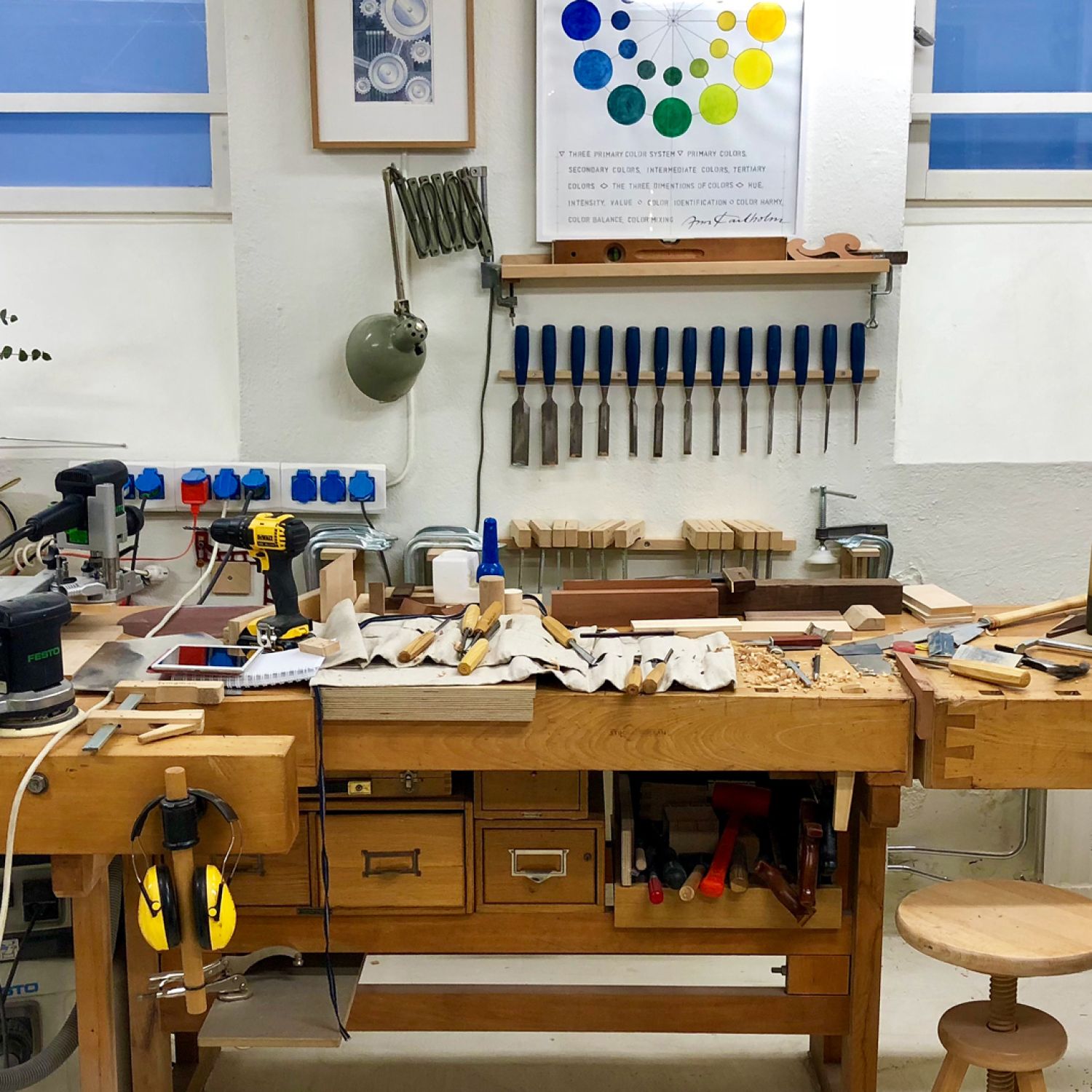 A messy wood work bench in a basement