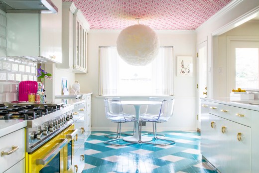 Colorful kitchen with bright wallpapered ceilling