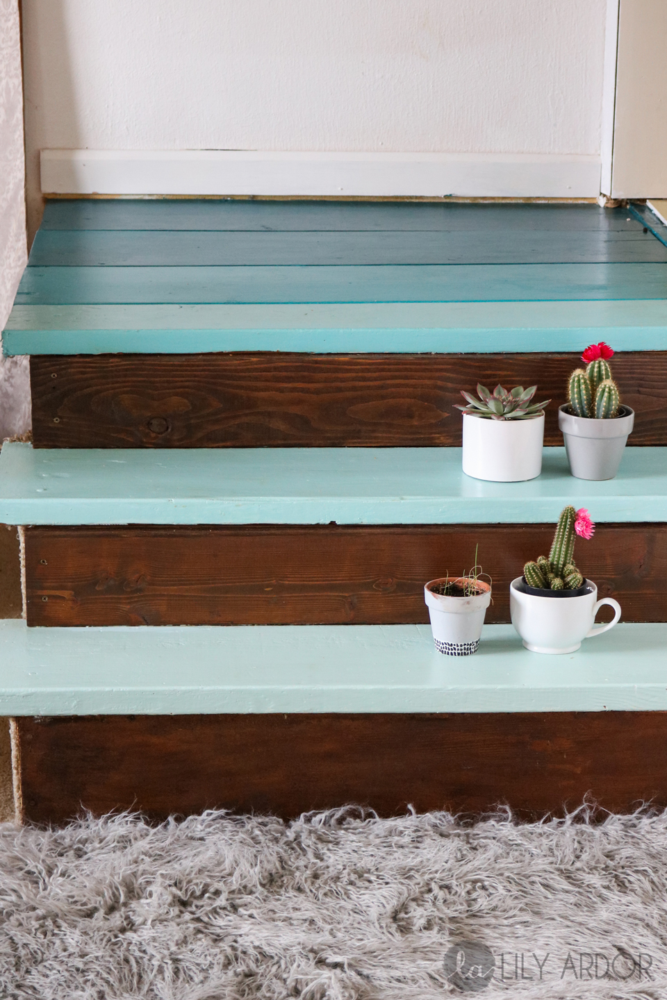 A blue ombre-painted small staircase