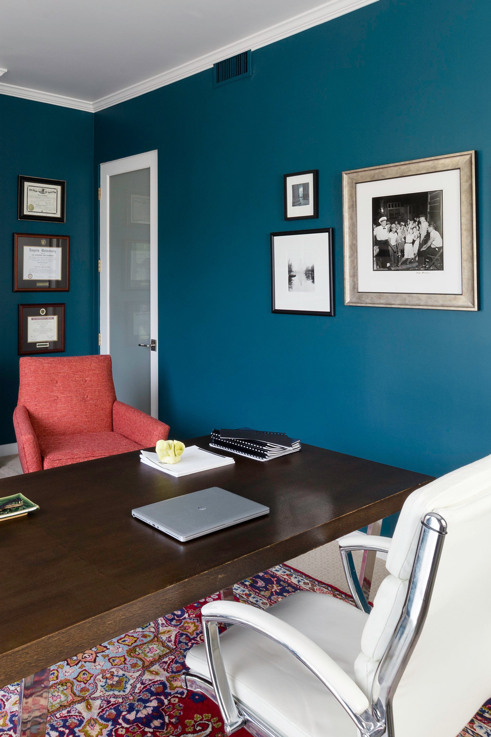 Teal-painted walls of a home office