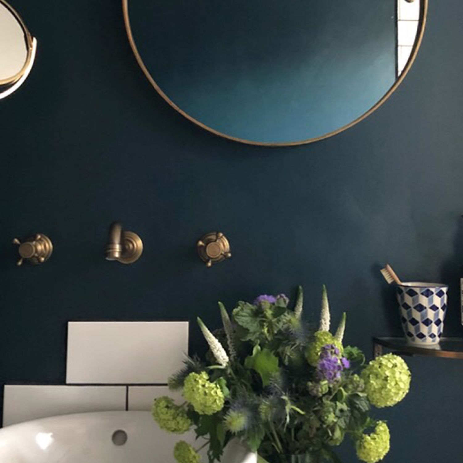 Updated bathroom with wall-mounted fixtures