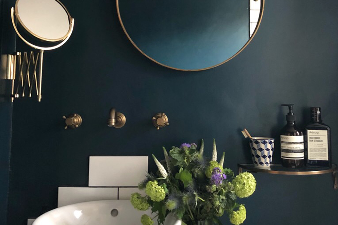 Updated bathroom with wall-mounted fixtures