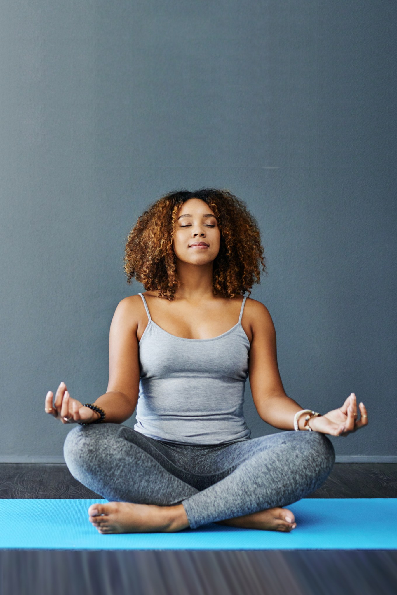 Woman at home doing yoga pose