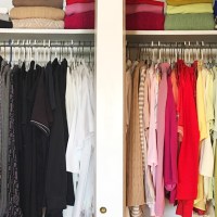Closet with tops organized in a color rainbow
