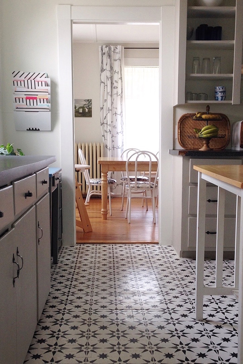 Wood kitchen floor painted white with navy blue stars