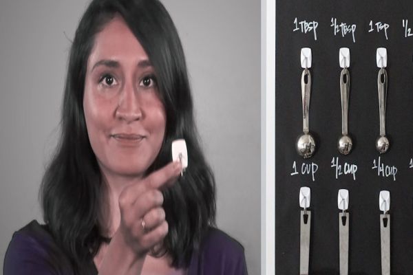 Split screen of Sahar and cupboard wall of spoons