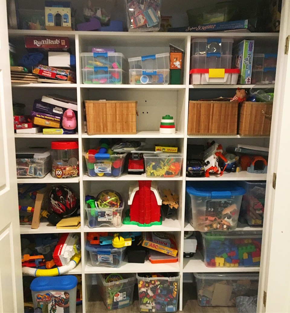 Closet full of toys haphazardly thrown inside