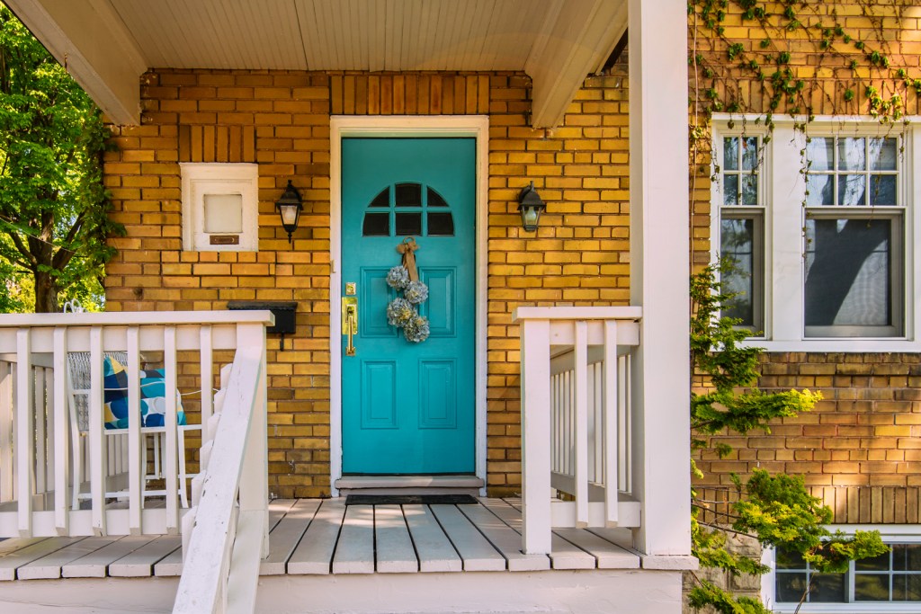 Home with small front porch in urban setting