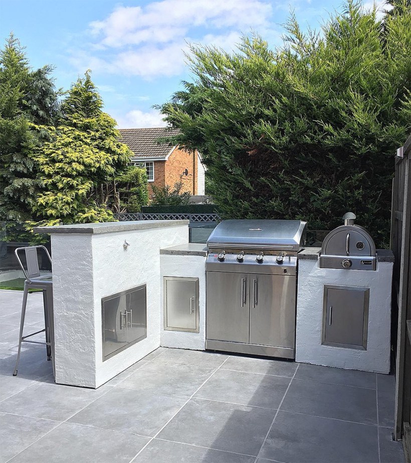 White concrete and stainless steal outdoor kitchen