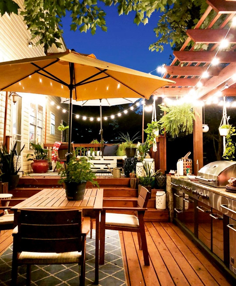 Outdoor dining area with yellow umbrella over table