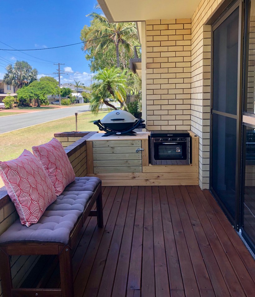 Small outdoor entertaining area with grill and oven