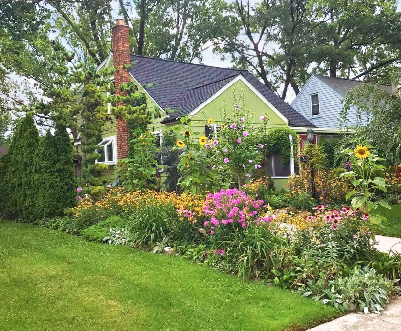 Front yard garden bed filled with perennial flowers