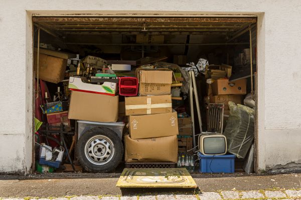 Open garage filled with boxes and old stuff