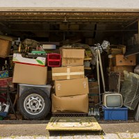 Open garage filled with boxes and old stuff