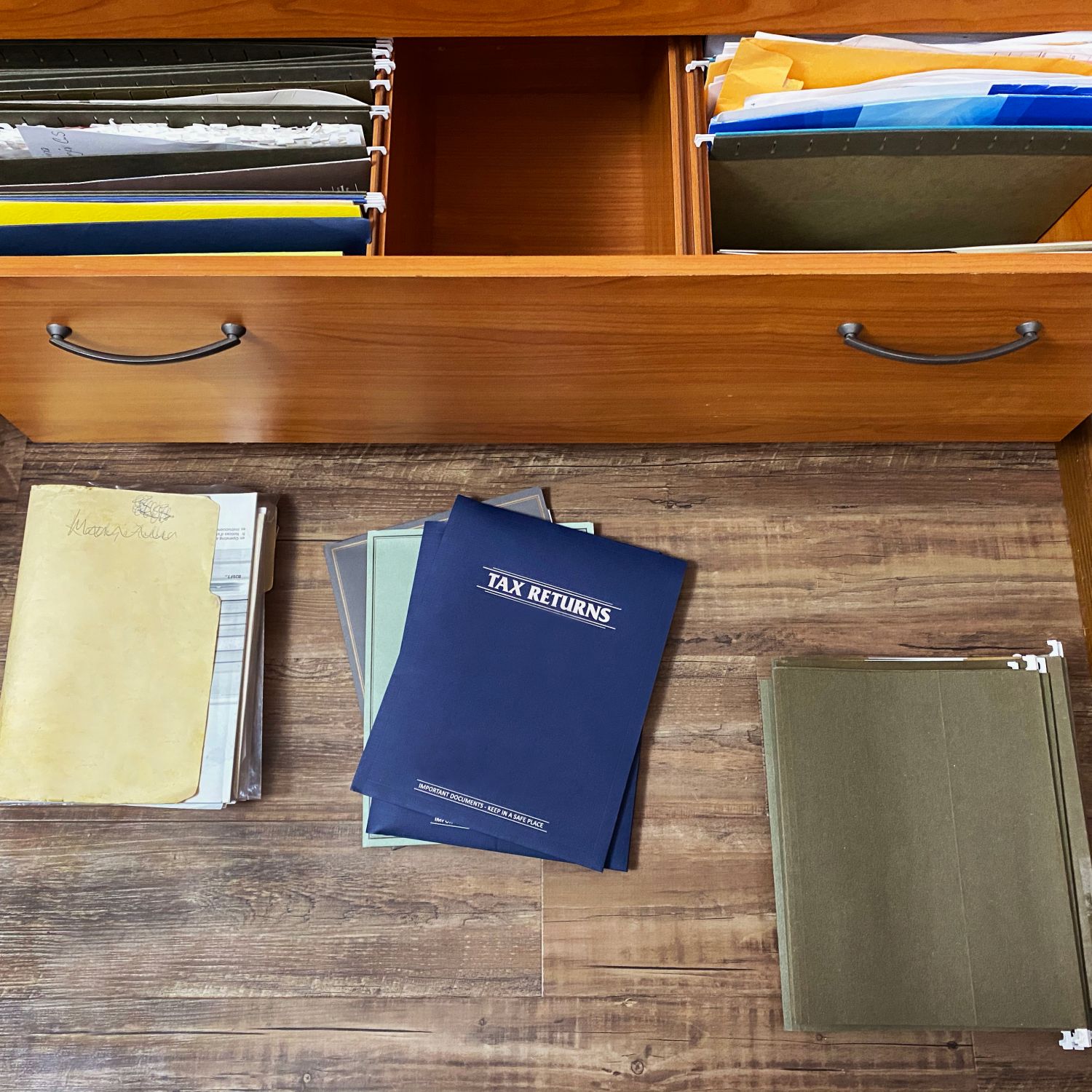 tax papers and files on floor and in file drawer