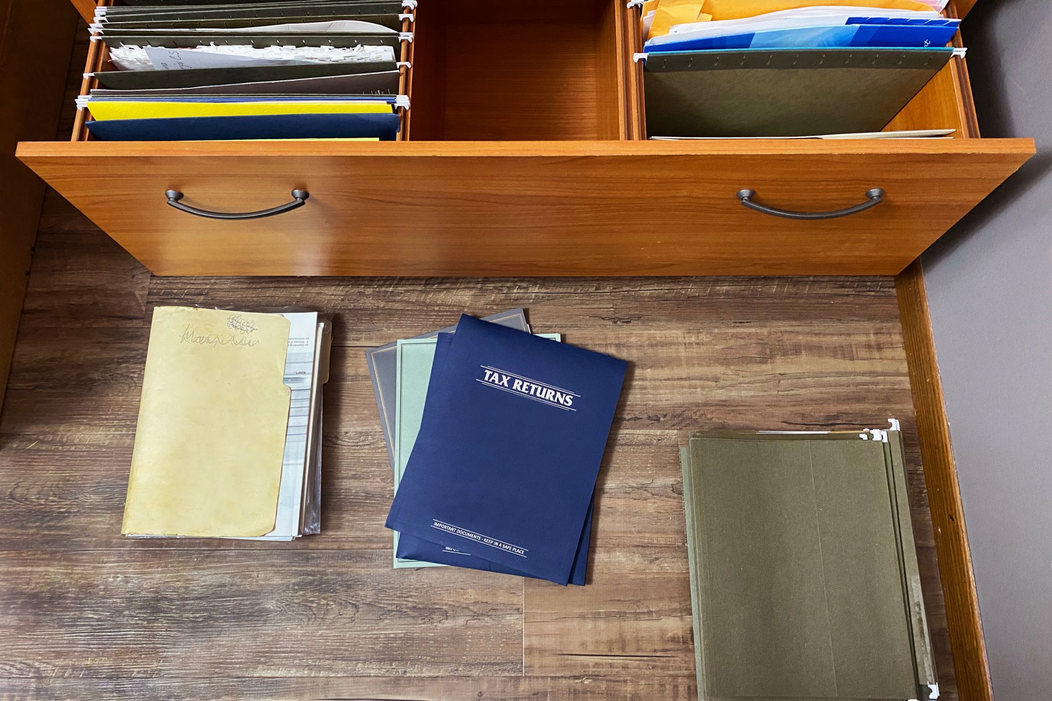 tax papers and files on floor and in file drawer