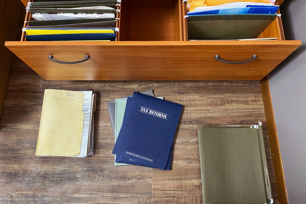 tax papers and files on floor and in file drawer