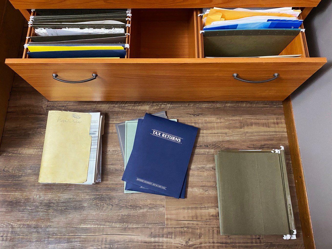 tax papers and files on floor and in file drawer