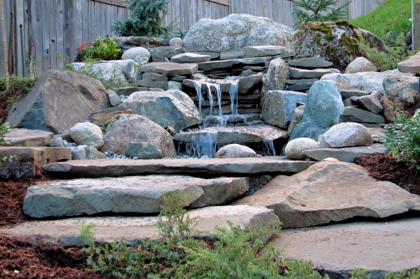 Drought-tolerant-water-feature-stone-creek-backyard
