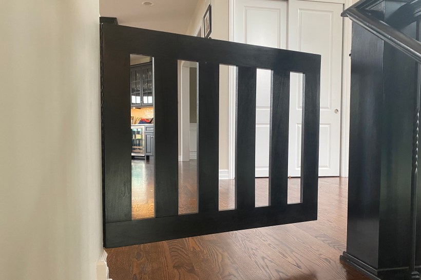 built in dog gate matching interior design in a home