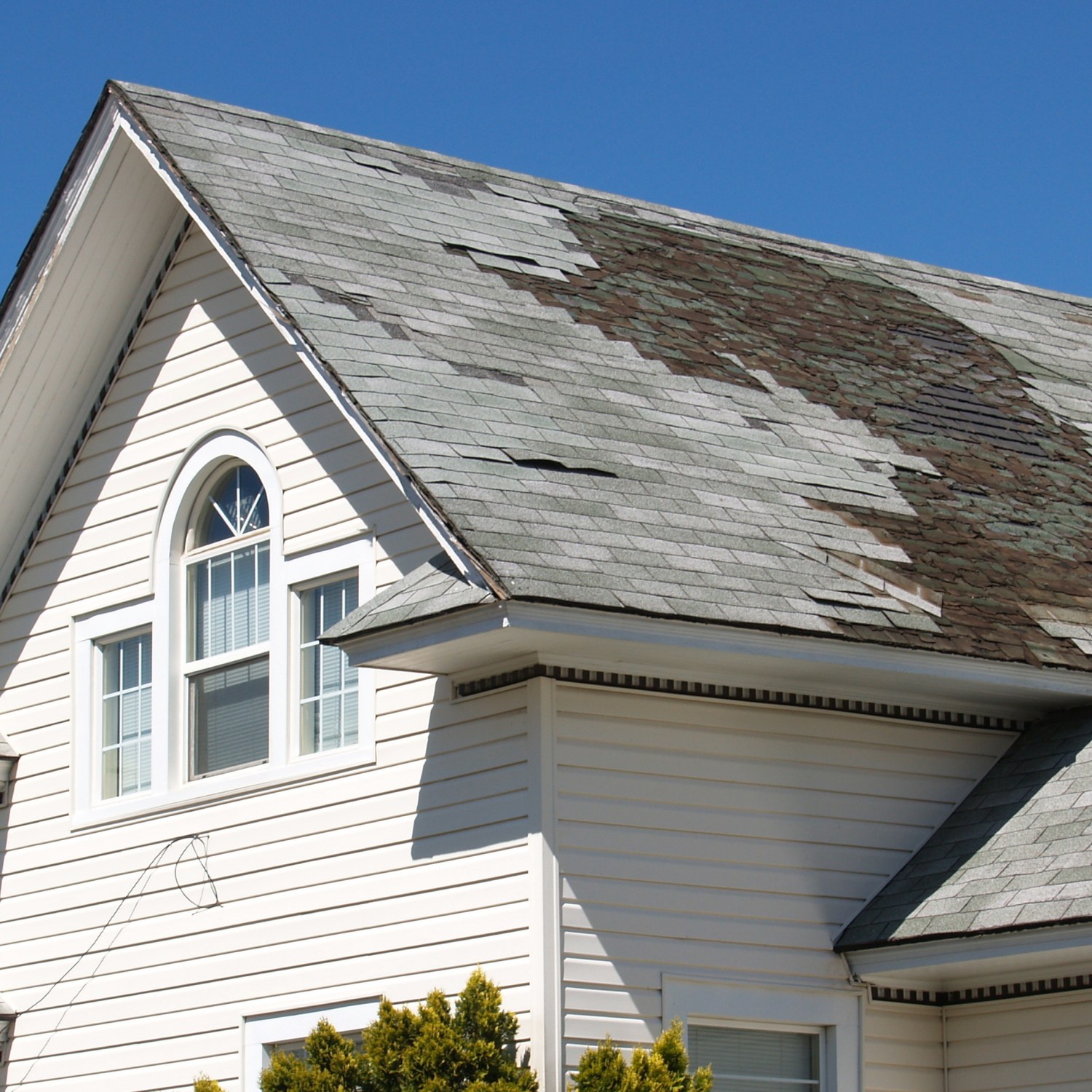 old-roof-repair-replace-white-house-damaged-shingles