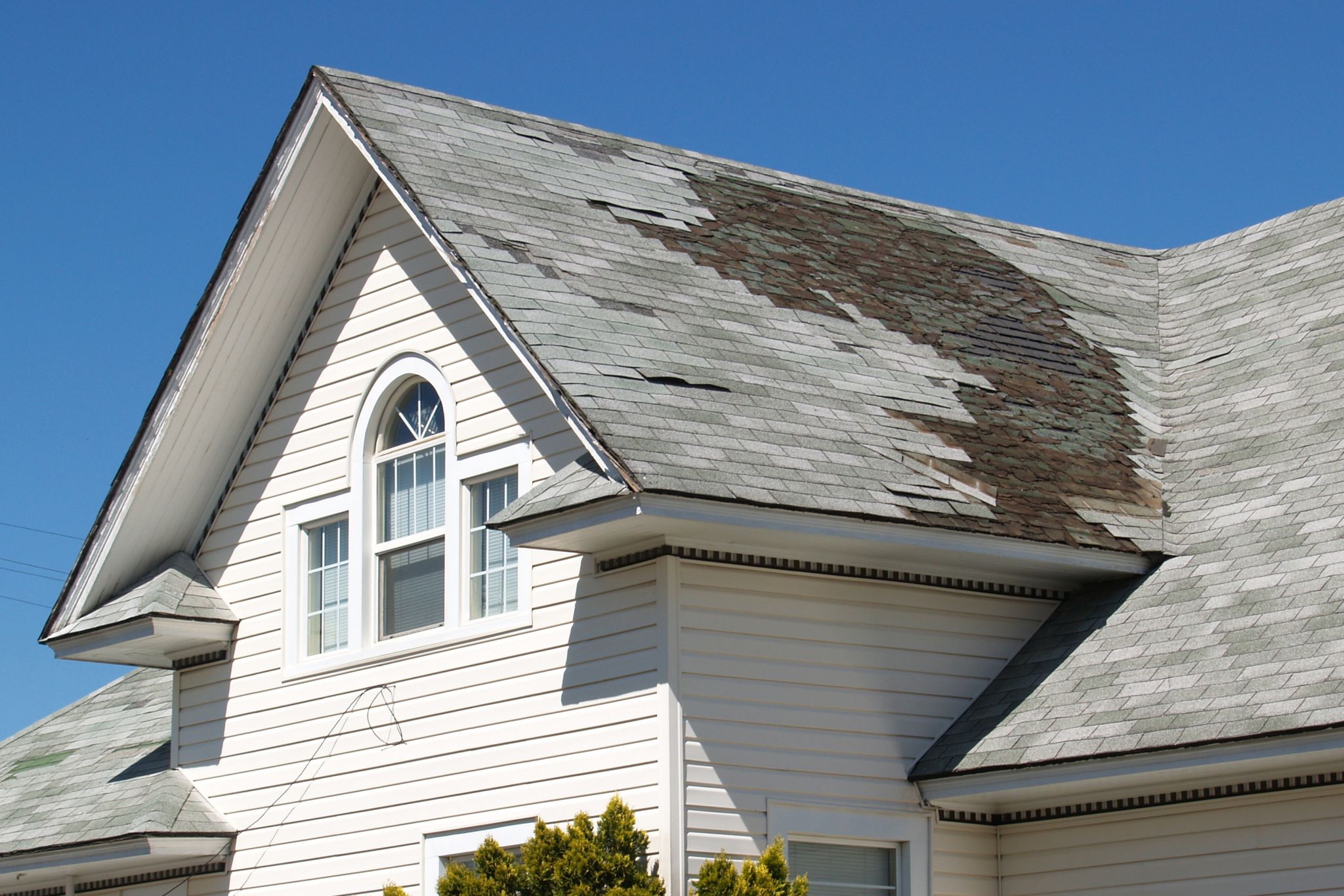 old-roof-repair-replace-white-house-damaged-shingles