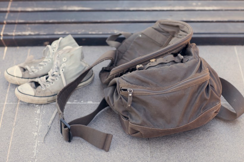 wash just about anything washing machine tips image of a pair of dirty gray sneakers along side a dirty brown backpack lying on the floor