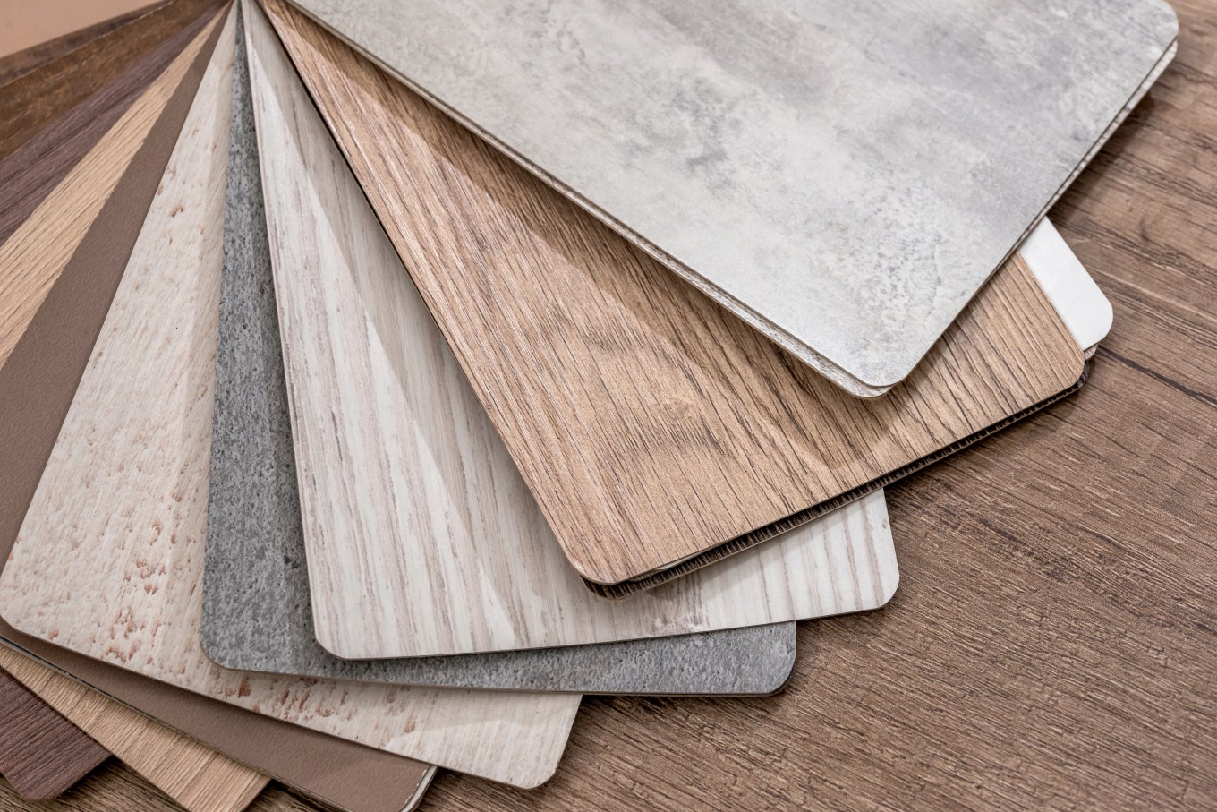swatches of laminate wood flooring with different colors and textures
