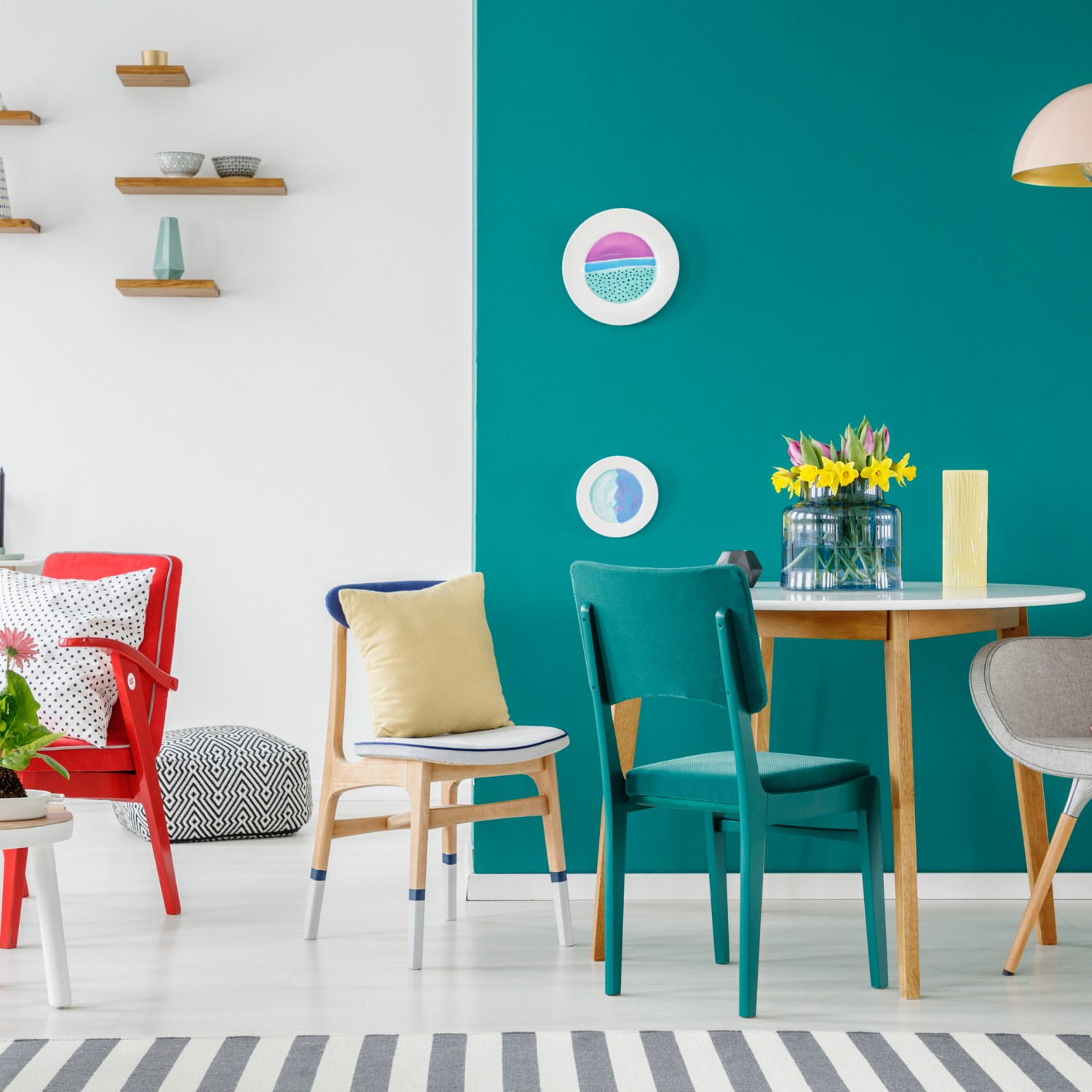diy make house a home colorful chairs at wooden tables against green wall in apartment interior with flowers