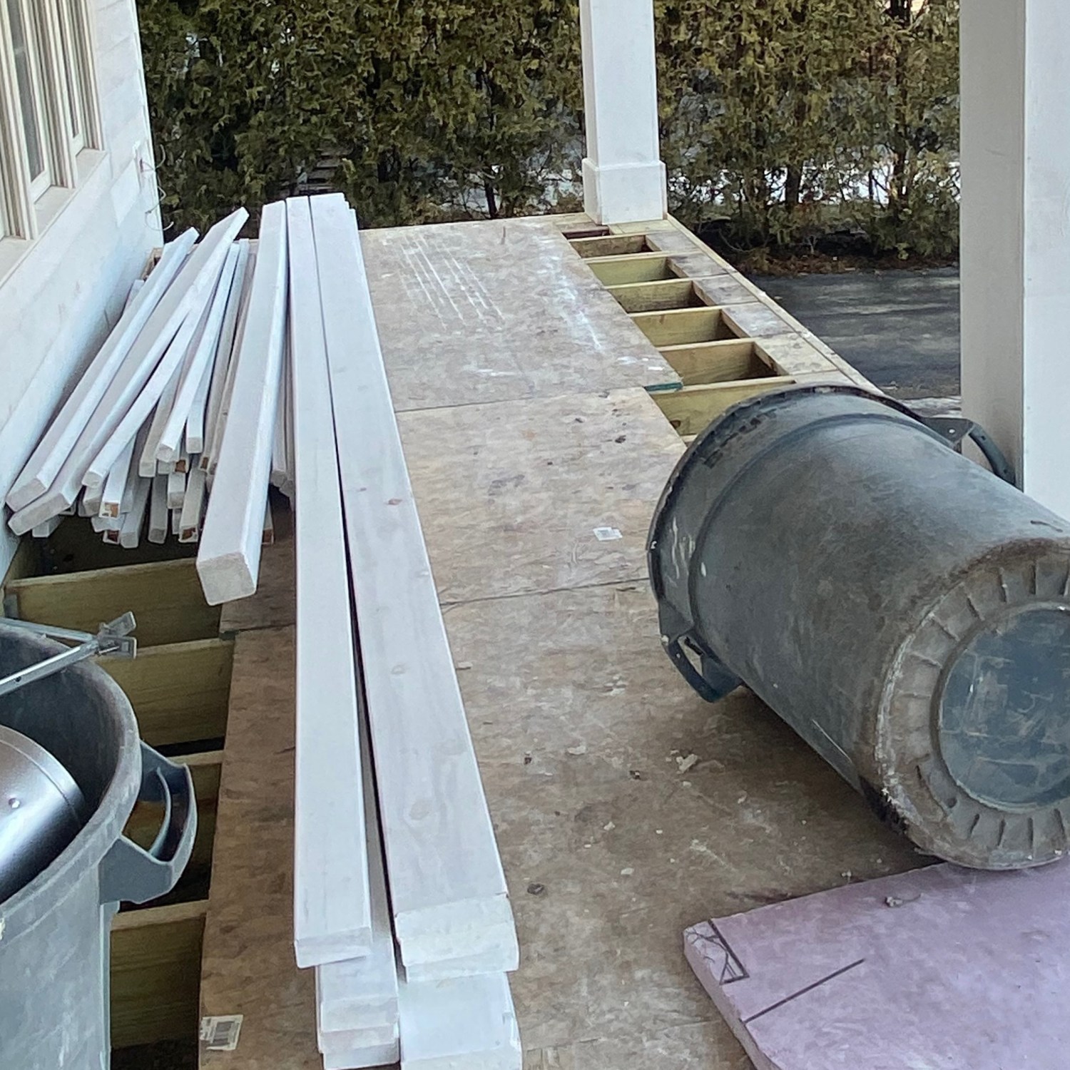 home remodel construction view of front porch with contractor work items boards beams electrical