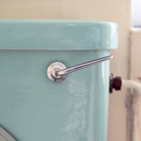 close up of retro turquoise toilet tank and flush handle fix sweaty condensation toilet