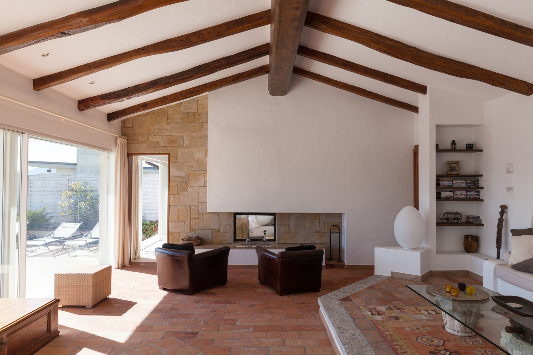 Vaulted ceiling in a living room with exposed wood beams