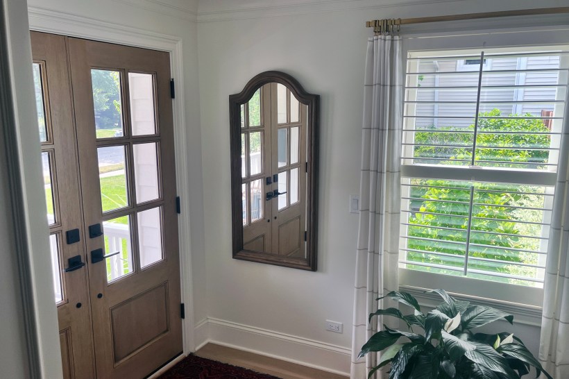 Beautiful front entryway with a mirror