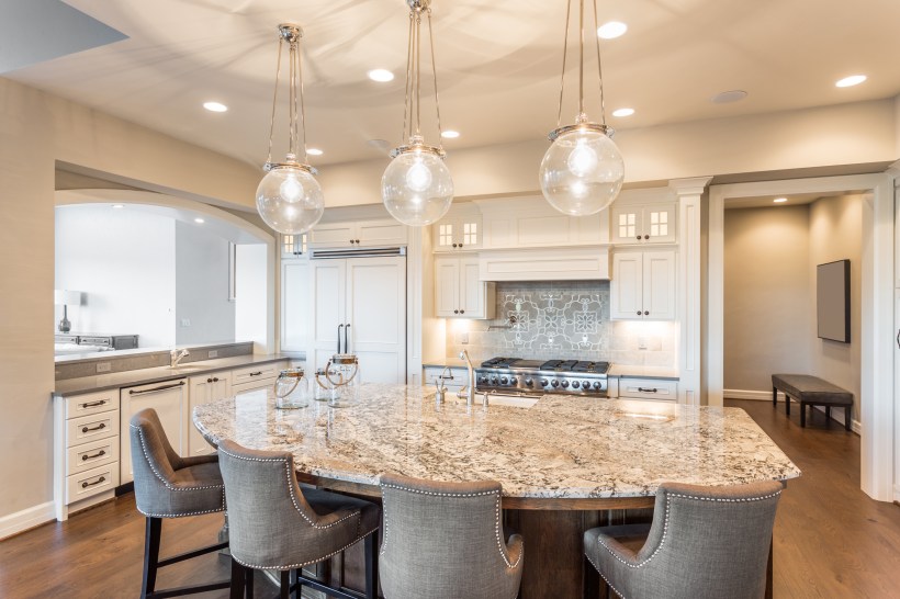 A newly furnished kitchen featuring a timeless design of a quartz table.