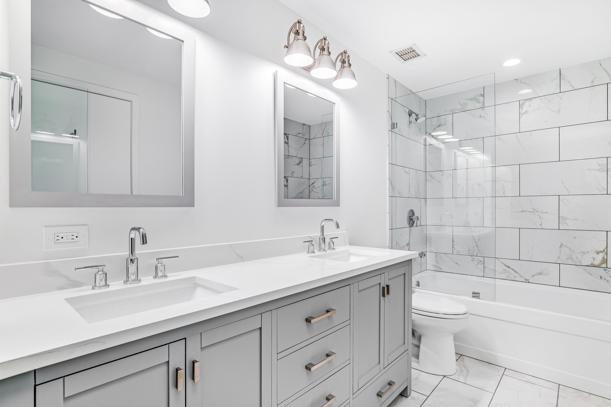 a small modern bathroom with a vanity and a built in washing