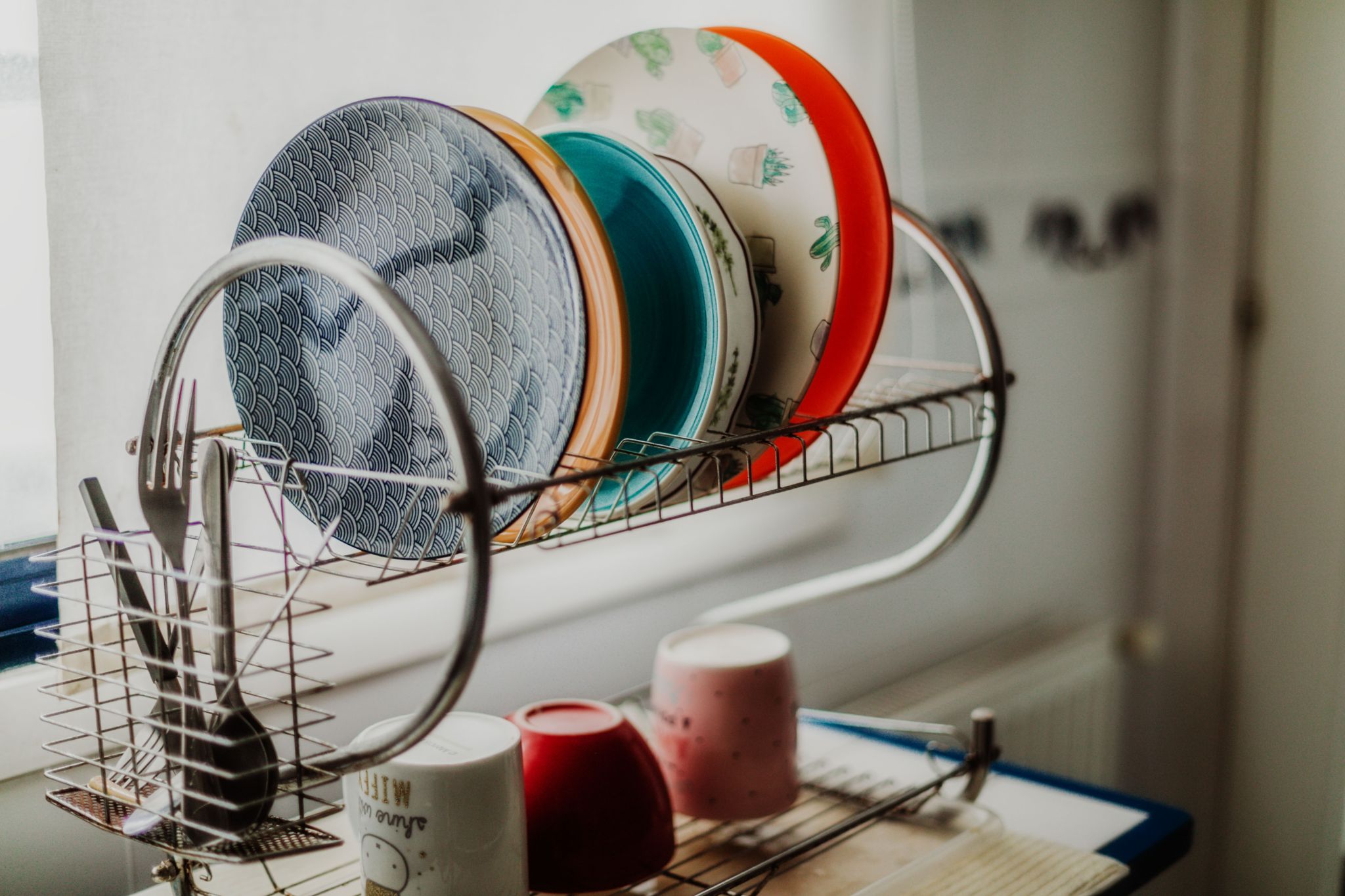 Plates on drying rack in the kitchen