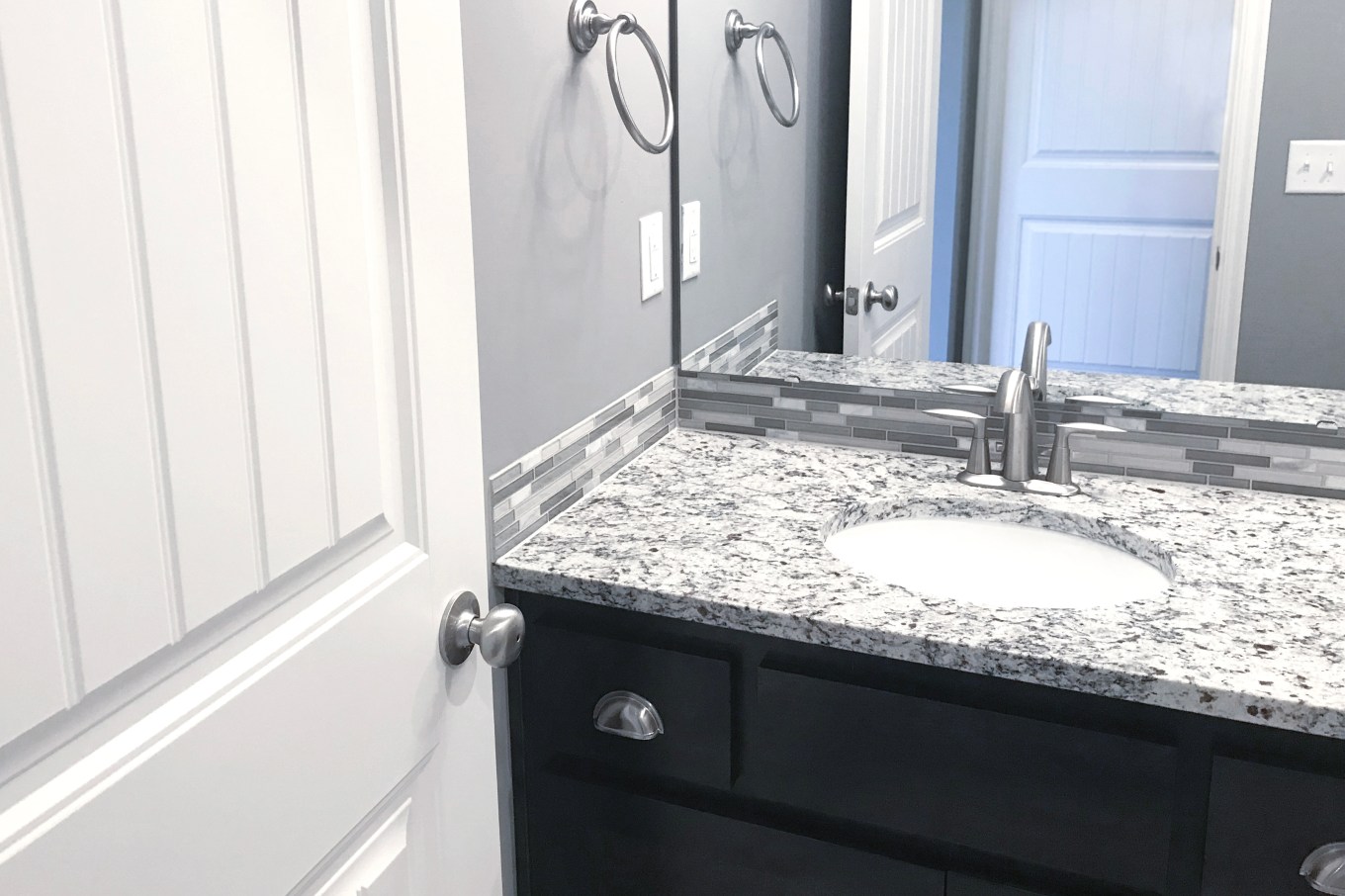 Beautiful remodeled bathroom featuring a quartz sink countertop.