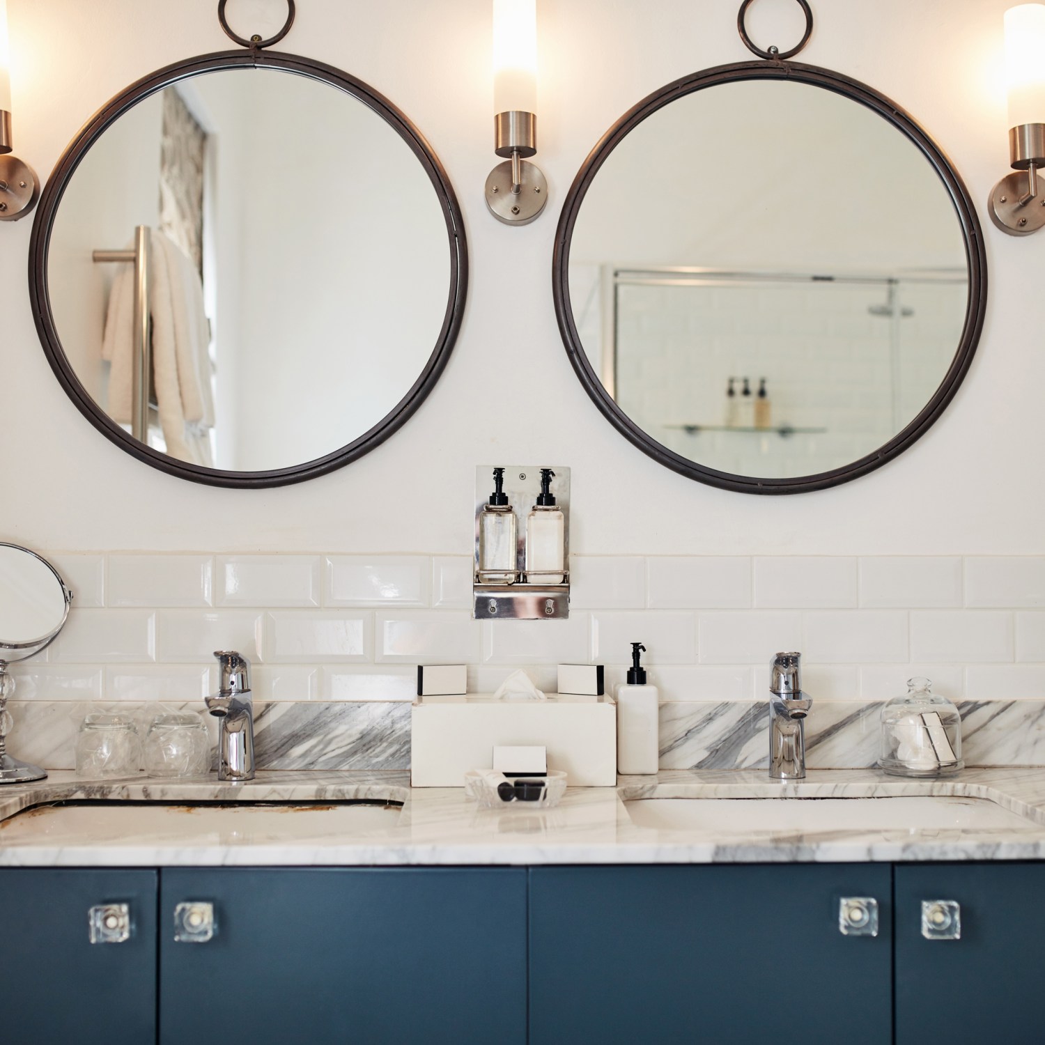 A bathroom with two mirrors and two sinks shows what a bathroom remodel could look like.