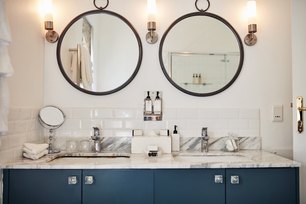 A bathroom with two mirrors and two sinks shows what a bathroom remodel could look like.