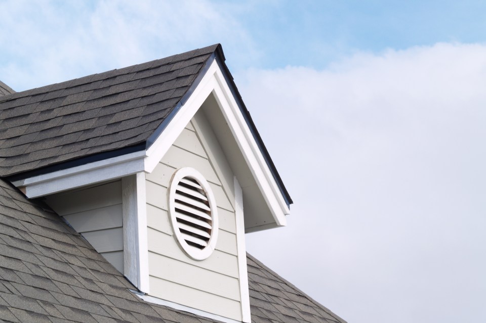 New home with a gable vent featured on the roof.