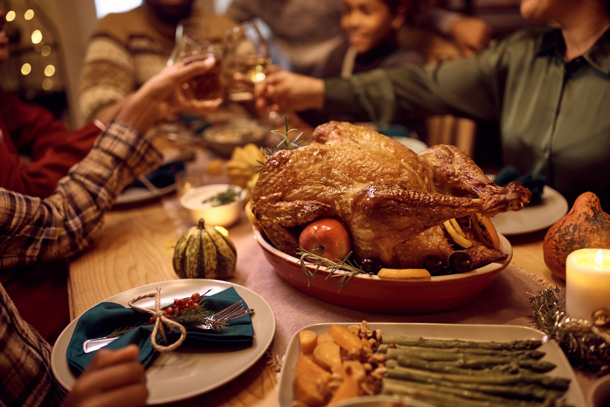 Close up of a Thanksgiving turkey during family dinner at the dining table.